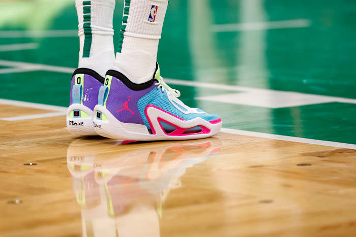 Boston Celtics forward Jayson Tatum's purple and blue Jordan Brand shoes.